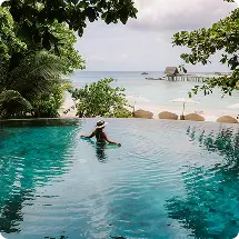 Tropical resort pool overlooking the beach
